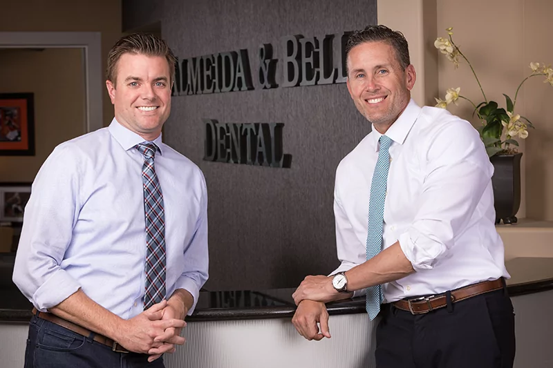 Cosmetic dentists Dr. Adam Almeida and Dr. Paul Bell at Almeida & Bell Dental Cosmetic, Implant & Sedation Dentistry in Lone Tree.