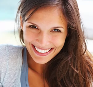 Smiling girl received cosmetic dental services in Lone Tree and Denver.