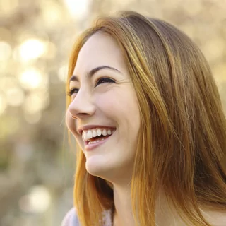 Smiling female sedation dentistry patient in Denver, CO