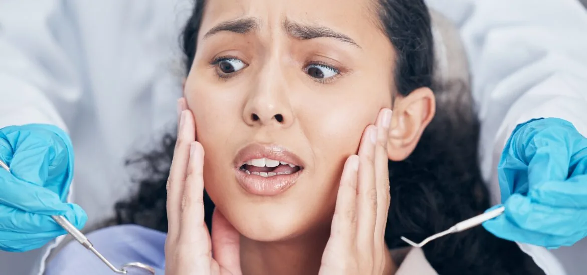 young woman suffering from dental anxiety, in need of sedation