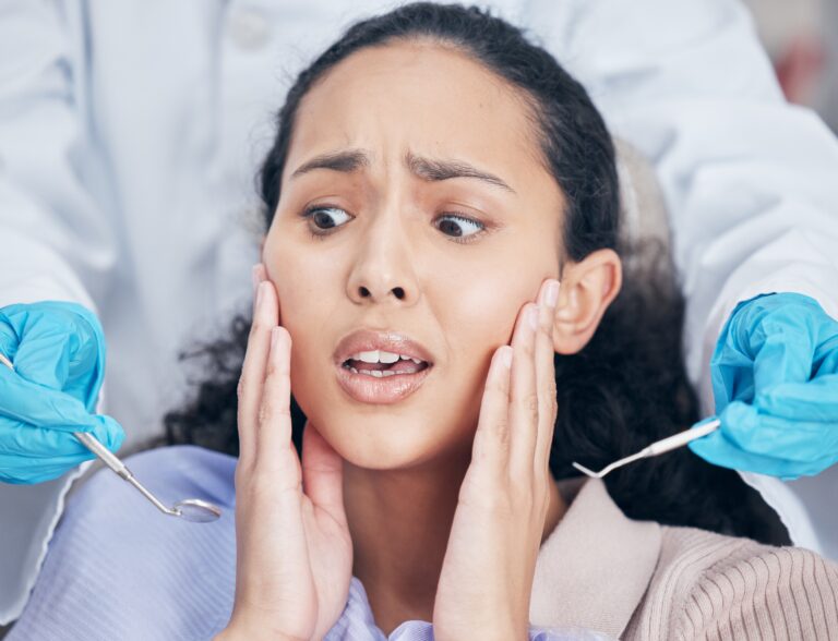 young woman suffering from dental anxiety, in need of sedation