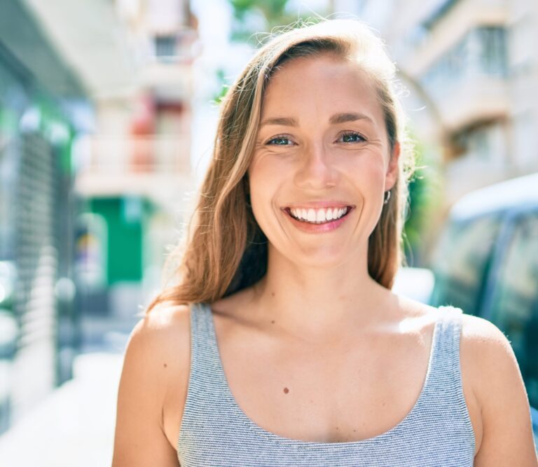 highlands ranch woman showing off perfect smile from cosmetic dentist in lone tree